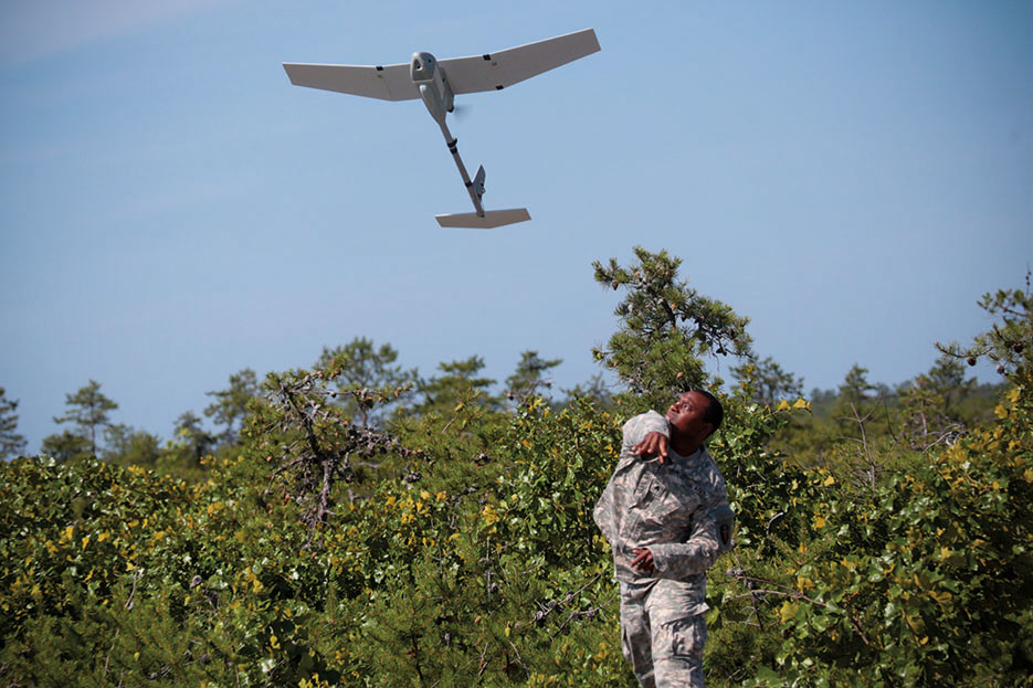 New Jersey National Guard Soldier from 50th Infantry Brigade Combat Team launches RQ-11 Raven unmanned aerial vehicle during joint exercise, Warren Grove Gunnery Range, New Jersey, June 2015 (U.S. Air National Guard/Matt Hecht)