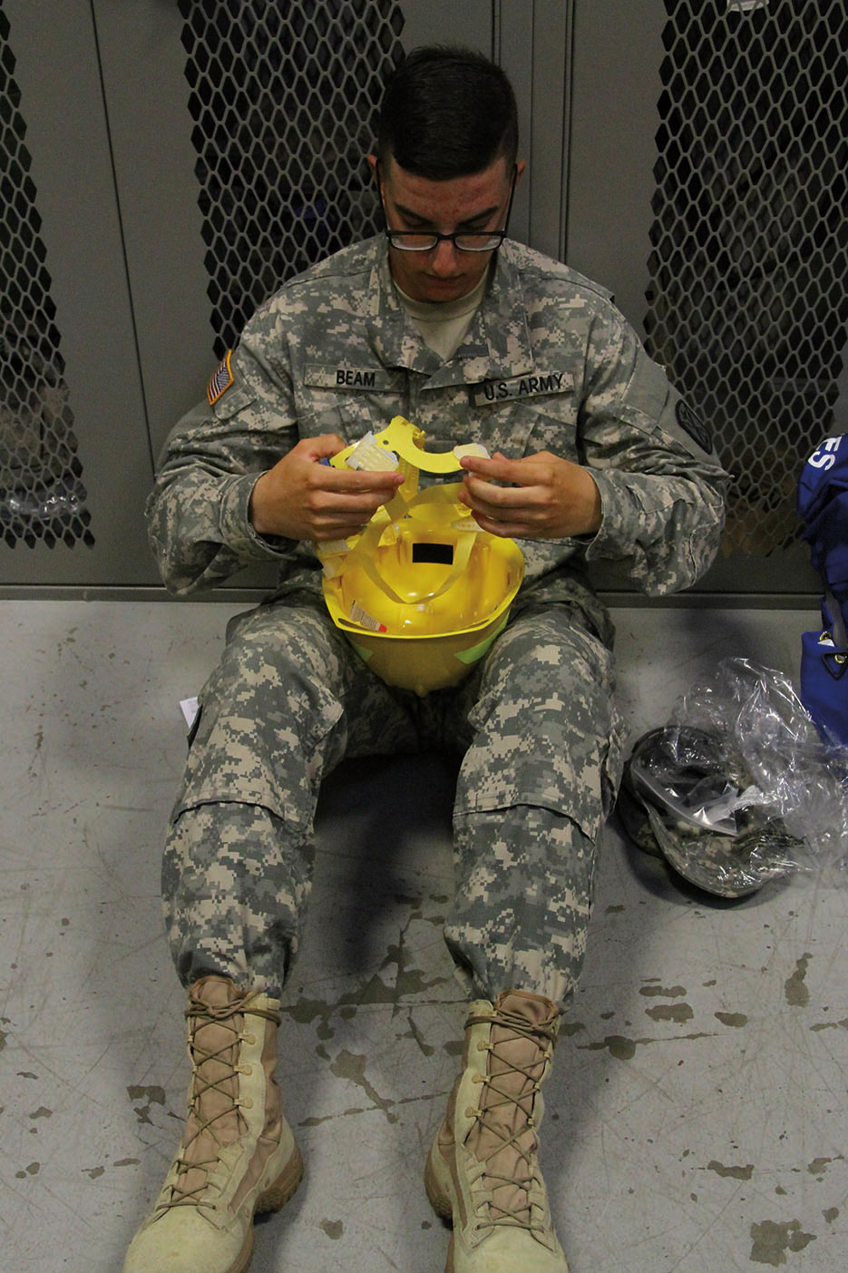 Soldier with 5th Battalion, 3rd Field Artillery Regiment, 17th Field Artillery Brigade, 7th Infantry Division readies firefighting gear at unit headquarters on Joint Base Lewis-McChord, Washington, August 2015 (28th Public Affairs Directorate/Patricia McMurphy)