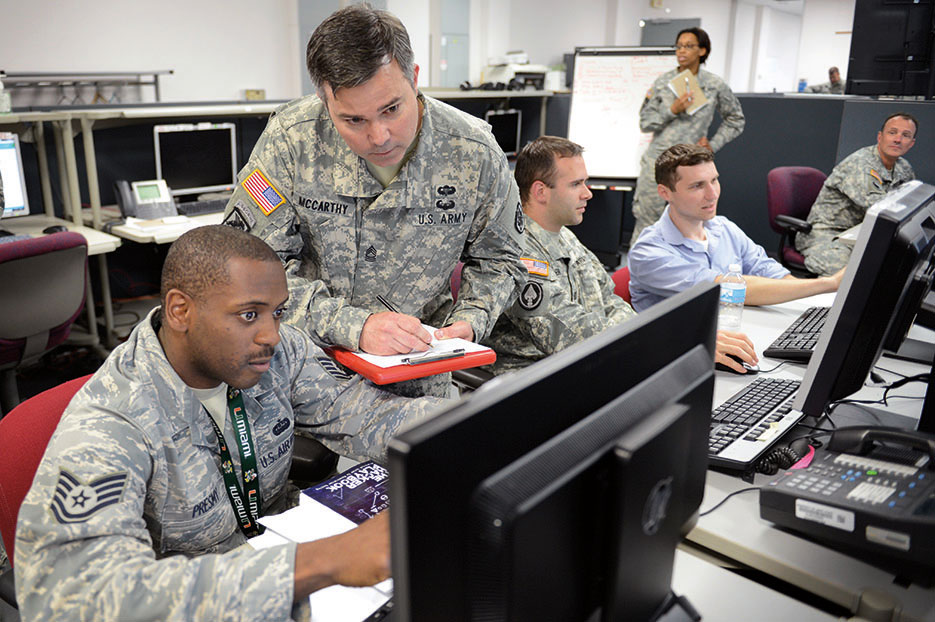 Joint Service and civilian personnel concentrate on exercise scenarios during Cyber Guard 2015 (DOD/Marvin Lynchard)