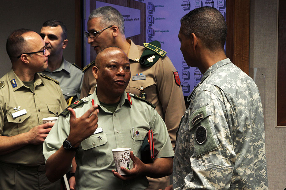 Uganda Brigadier General Apollo Kasiita-Gowa talks to U.S. Army Pacific Commanding General, General Vincent K. Brooks, during U.S. Army War College International Fellows program’s visit where 39 participants received firsthand experience on strategic-level leadership and national security challenges (U.S. Army/Kyle J. Richardson)