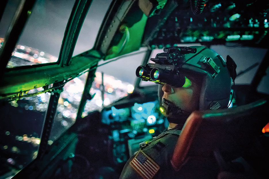 C-130 Hercules pilot with 36th Airlift Squadron performs visual confirmation with night vision goggles during training mission over Kanto Plain, Japan, October 14, 2015 (U.S. Air Force/Osakabe Yasuo)
