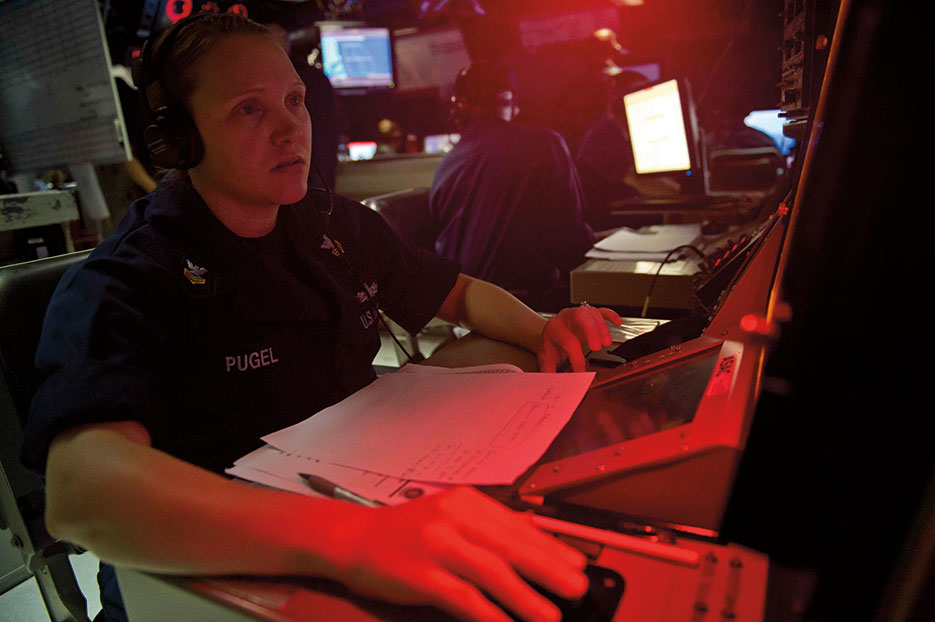 Sailor monitors subsurface contacts in combat information center aboard guided-missile destroyer USS Jason Dunham in Atlantic Ocean, as part of simulated wargames, May 19, 2014 (U.S. Navy/Derek Paumen)