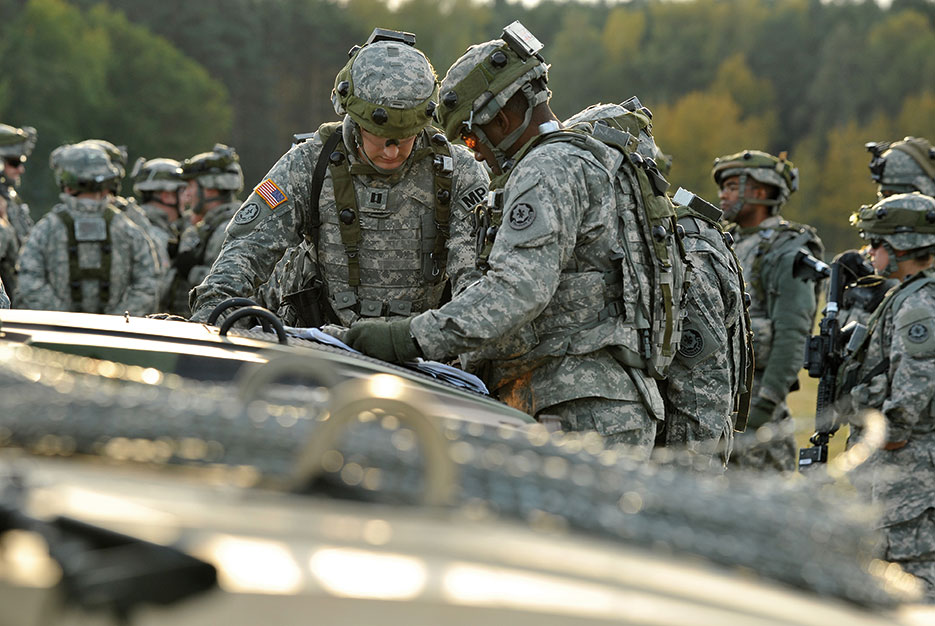 U.S. Soldiers with 2nd Cavalry Regiment study map in preparation for convoy through area near Amberg, Germany, en route to U.S. Army Europe Joint Multinational Readiness Center’s Hohenfels Training Area in Germany, October 16, 2012, during Saber Junction 2012 (DOD/Markus Rauchenberger)