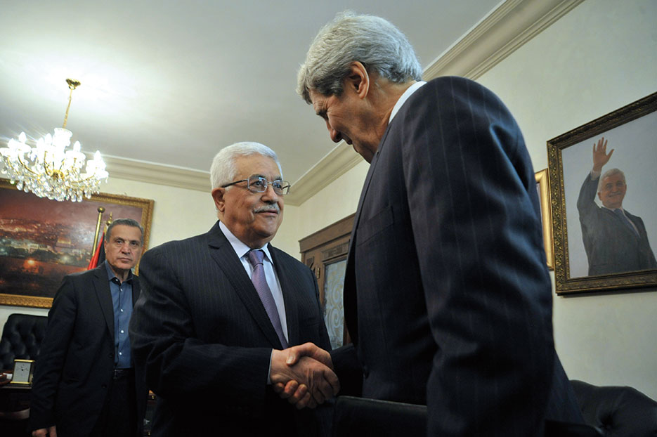 Palestinian Authority President Mahmud Abbas greets U.S. Secretary of State John Kerry as he arrives for meeting in Amman, Jordan, June 2013 (State Department)