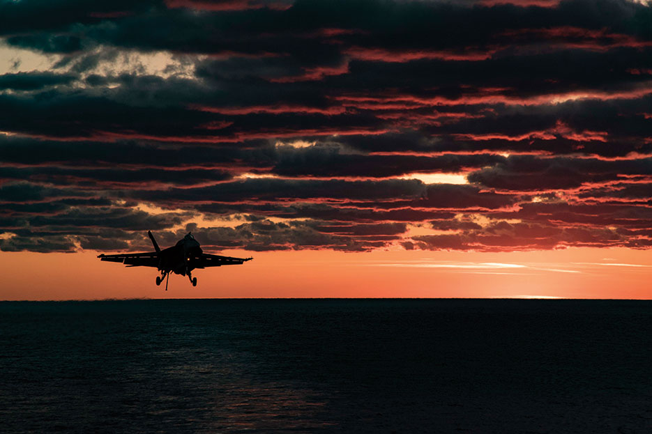 F/A-18E Super Hornet assigned to Gunslingers of Strike Fighter Squadron 105 prepares to make arrested landing on flight deck of aircraft carrier USS Dwight D. Eisenhower, April 9, 2017 (U.S. Navy/Anderson W. Branch)