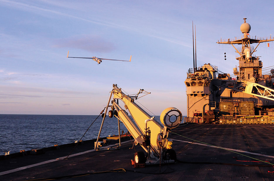 Scan Eagle unmanned aerial vehicle designed to provide multiple surveillance, reconnaissance data, and battlefield damage assessment missions launches from amphibious dock landing ship USS Comstock, February 25, 2011 (U.S. Navy/Joseph M. Buliavac)