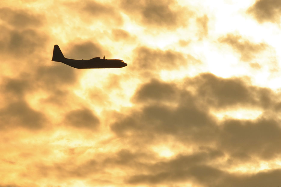 U.S. Air Force C-130 Hercules flies over Hopfenohe Drop Zone while conducting static line airborne operations with paratroopers assigned to Special Operations Command Africa at 7th Army Joint Multinational Training Command’s Grafenwoehr Training Area, Germany, September 25, 2013 (U.S. Army/ Markus Rauchenberger)