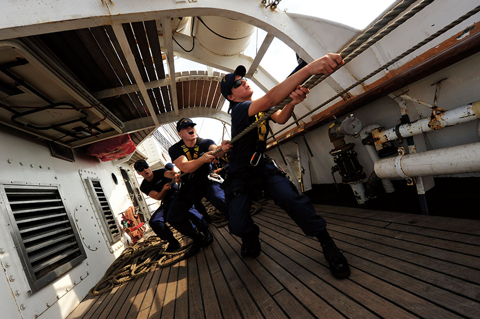 U.S. Coast Guard officer candidates aboard Coast Guard Barque Eagle haul on fore upper topsail brace during sail stations at sea in Atlantic Ocean, September 16, 2013 (DOD/U.S. Coast Guard)