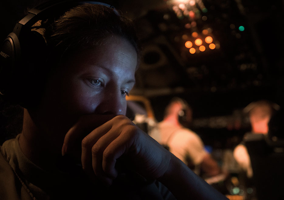 Airman assigned to 340th Expeditionary Air Refueling Squadron communicates with KC-135 Stratotanker pilots above Southwest Asia, July 20, 2017, in support of Operation Inherent Resolve (U.S. Air Force/Trevor T. McBride)