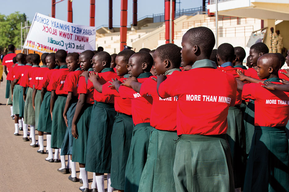 Students march to Nyakuron Cultural Center in Juba, South Sudan, April 2, 2015, during International Day for Mine Awareness and Assistance in Mine Action (Courtesy UN/JC McIlwaine)