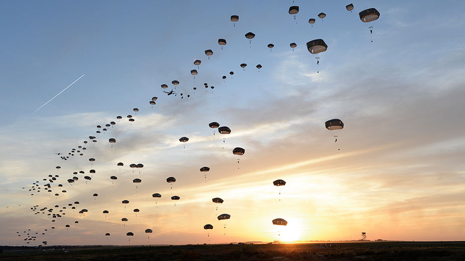 U.S. Army and British paratroopers perform static line jump at Holland Drop Zone in preparation for Combined Joint Operational Access Exercise 15-01, demonstrating interoperability between U.S. Army and British army soldiers, U.S. Air Force, Air National Guard and Royal Air Force airmen, and U.S. Marines, April 11, 2015, Fort Bragg, North Carolina (U.S. Air Force/Sean Martin)