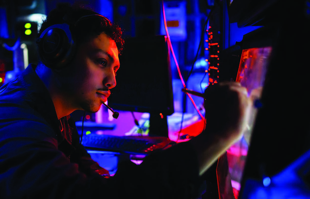 Operations Specialist 2nd Class Edmundo Chavez monitors electronic warfare module inside combat information center of guided-missile destroyer USS Gridley during exercise Rim of the Pacific 2024, in and around Hawaiian Islands, July 19, 2024 (U.S. Navy/Jesse Monford)