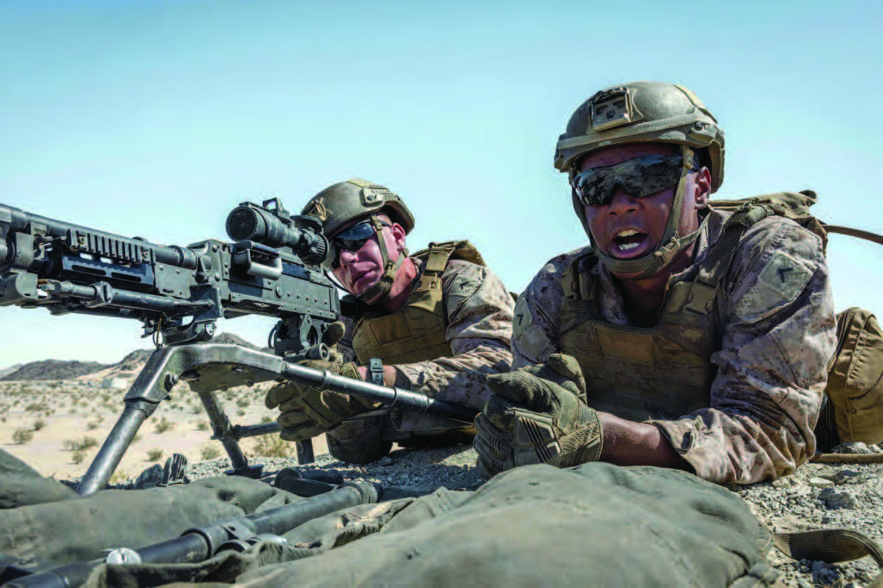 Marine Corps Private First Class James West, right, and Private First Class Justin Ulrich, both with Heavy Machine Guns platoon, 1st Battalion, 7th Marine Regiment, execute M240B machine gun firing drills at Marine Corps Air Ground Combat Center, Twentynine Palms, California, June 25, 2024 (U.S. Marine Corps/Iris Gantt)