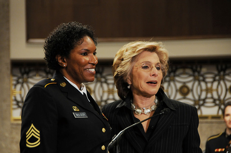 Senator Barbara Boxer of California, right, presents Senate Resolution to recognize accomplishments of women in the military to Sergeant First Class Juanita Wilson, a wounded warrior, during Joint Services Women’s History Month Observance on Capitol Hill, March 2010 (U.S. Army)