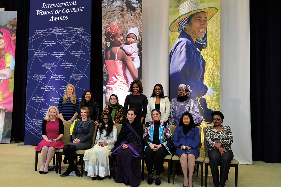 First Lady Michelle Obama, Deputy Secretary Heather Higginbottom, and U.S. Ambassador-at-Large for Global Women’s Issues Catherine Russell with 2014 Secretary of State’s International Women of Courage Awardees, Washington, DC, March 2014 (State Department)